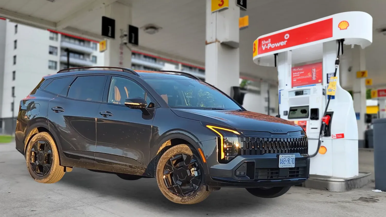 KIA Sportage at a Shell gas station during a fuel economy test
