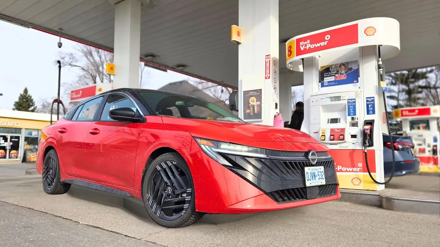 Nissan Sentra at a Shell gas station during a fuel economy test